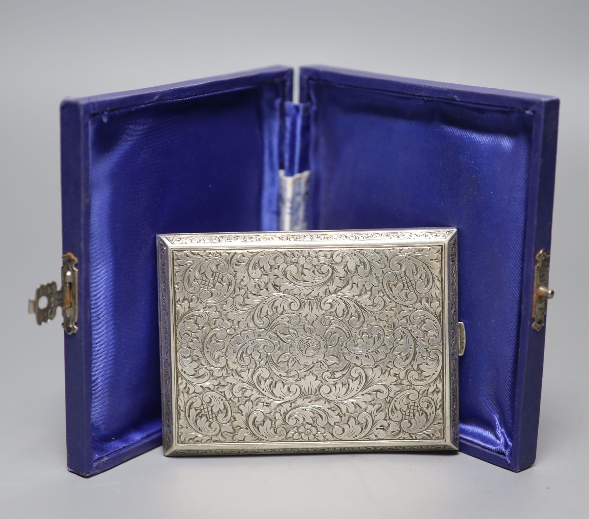 A 20th century Austrian engraved 900 standard white metal cigarette case, 10.3cm, gross 5oz.